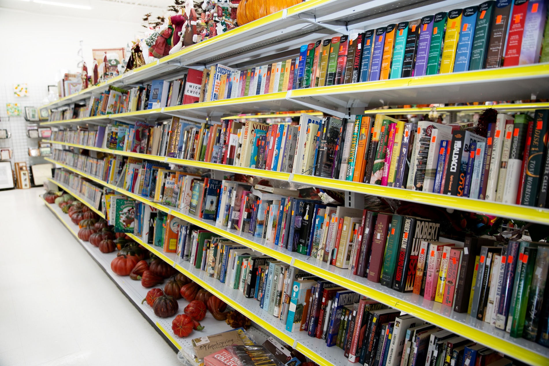 Stacks of donated books on a sorting table