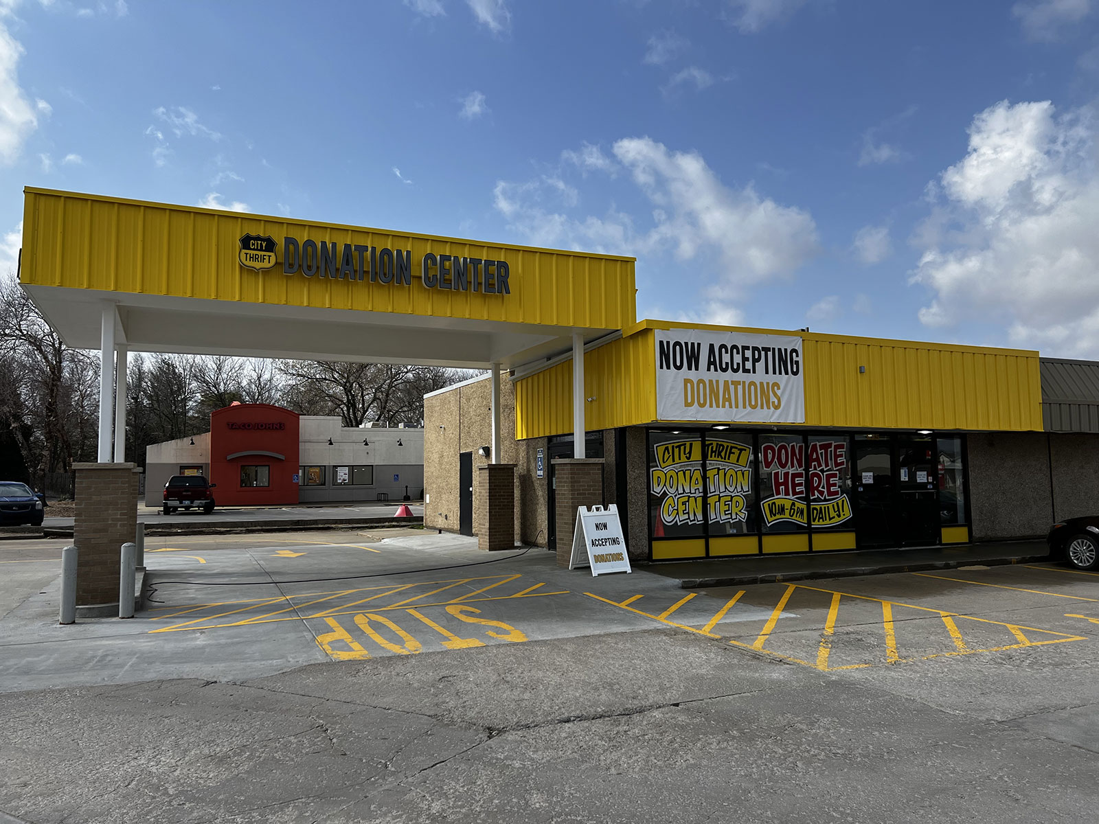 City Thrift Donation Center in Lawrence with yellow awning