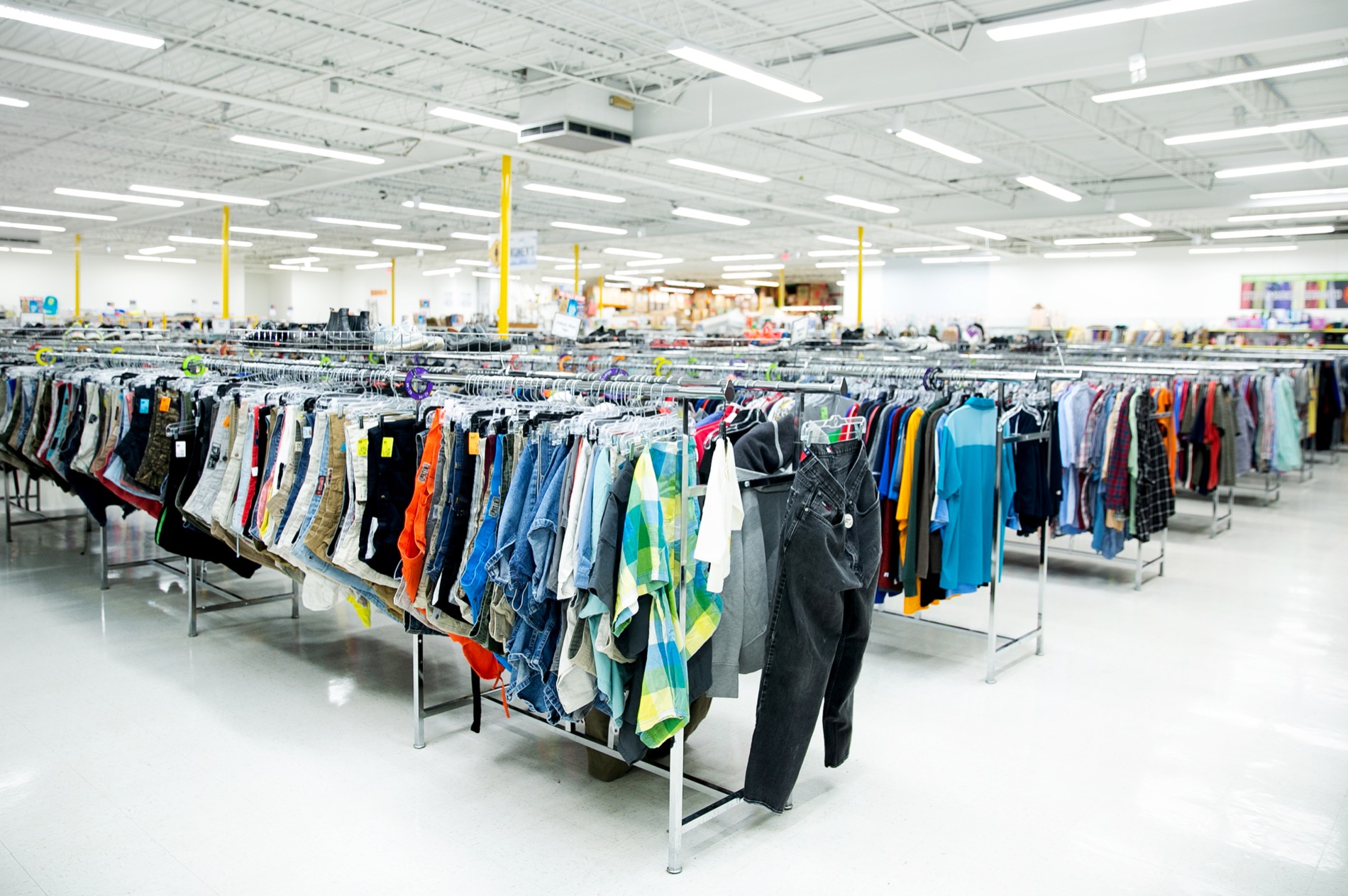A City Thrift sales associate organizing inventory on the sales floor
