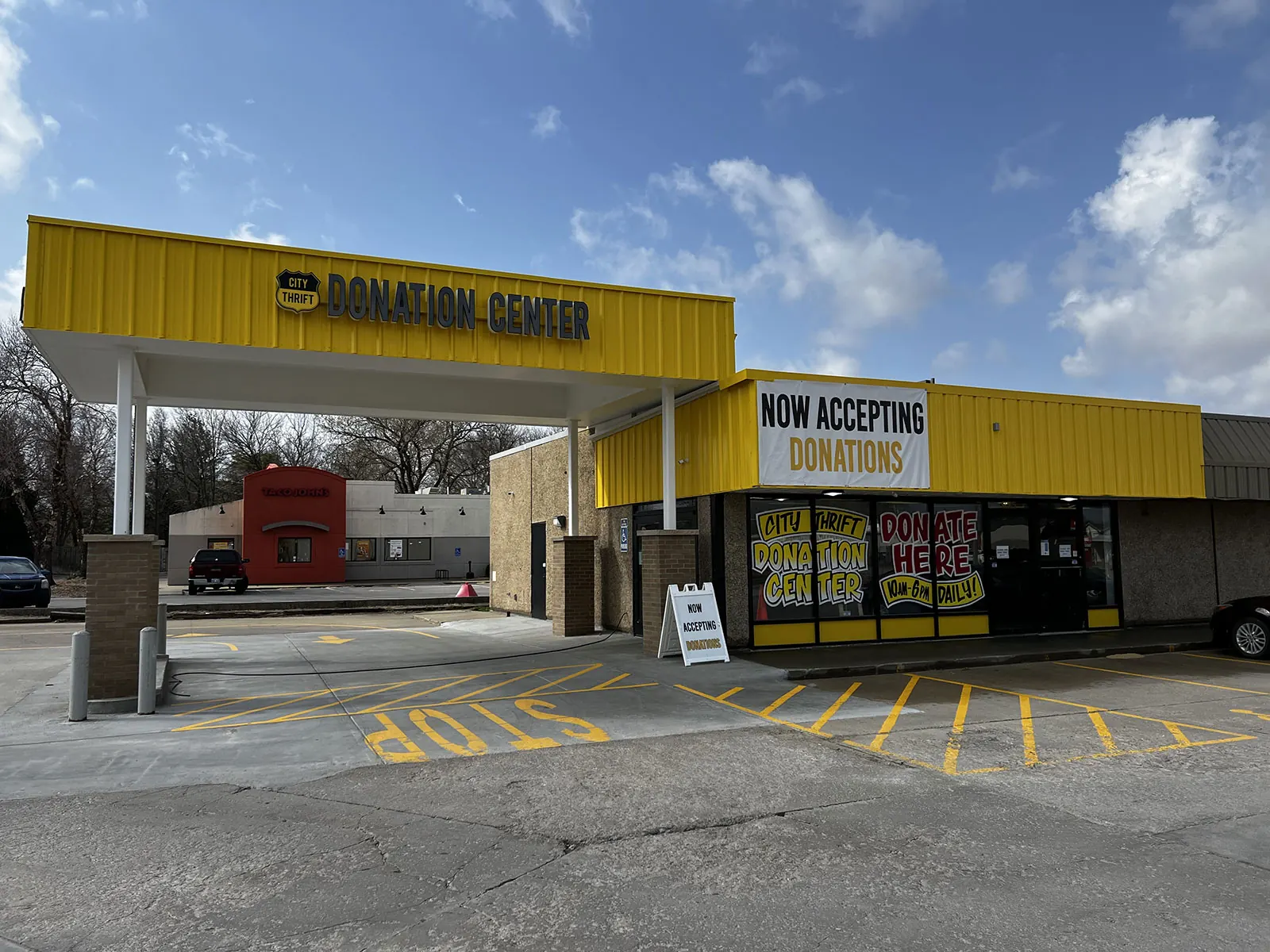City Thrift Donation Center in Lawrence with yellow awning